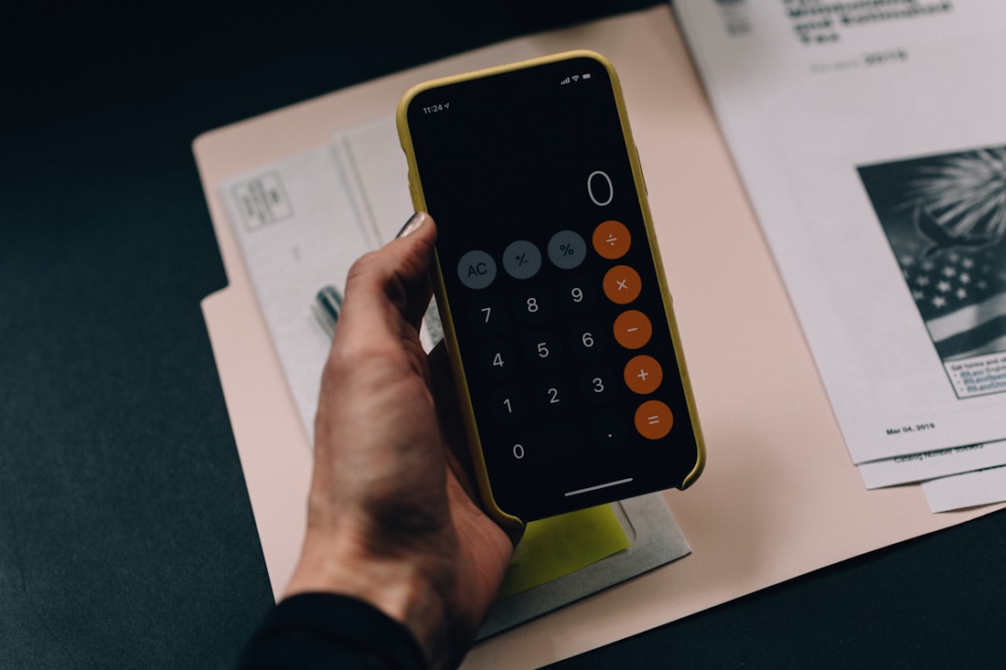 Documents and calculator prepared for a secure financial transaction